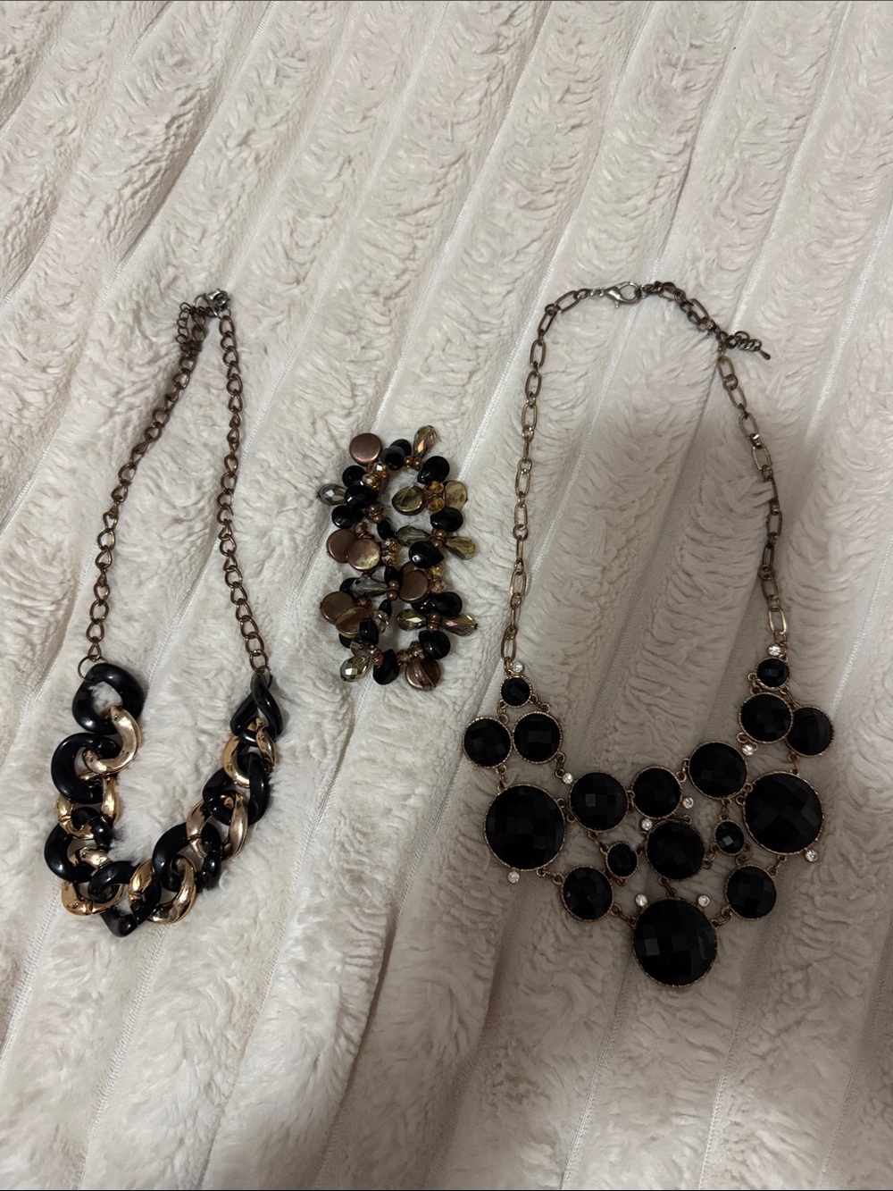 Black and gold costume Necklace x2 and 2 bracelets.